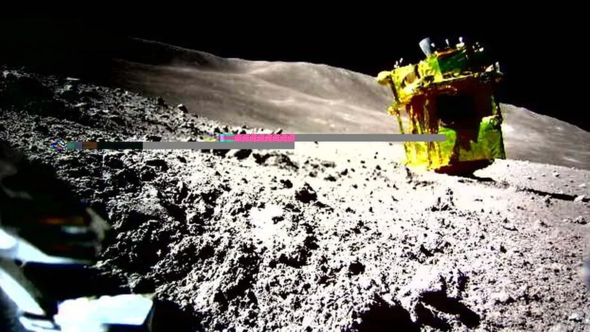 A yellow-colored spacecraft is upside down on the moon. There